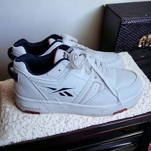 Child size 2 white, red and blue leather sneaker.